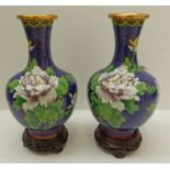 PAIR OF CLOISONNE VASES DECORATED WITH BIRDS AND FLOWERS ON HARDWOOD STRANDS, 20CM TALL