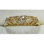 5-STONE CUSHION SHAPED DIAMOND RING IN CLAW SETTING MARKED 18CT