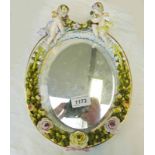 CONTINENTAL PORCELAIN FRAMED MIRROR SURROUNDED WITH CHERUBS - 28CM TALL