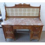 LATE 19TH CENTURY WALNUT WASHSTAND WITH TILE BACK OVER DRAWER FLANKED BY PANEL DOORS AND TURNED