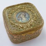 CIRCULAR GILDED METAL JEWELLERY BOX, WITH CENTRALLY SET PORTRAIT PANEL