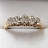 9 CARAT GOLD RING SET WITH 5 CLUSTERS OF DIAMONDS