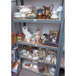 SELECTION OF PORCELAIN INCLUDING PLATES, WINE GLASSES, CUTLERY AND OTHERS ON FOUR SHELVES