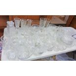 A LARGE SELECTION OF CRYSTAL & CUT GLASS TO INCLUDE BOWLS, JUGS, VASES, DECANTERS ETC