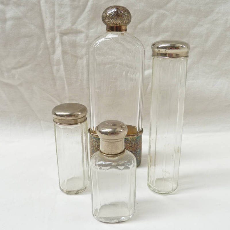 A CUT GLASS SCENT BOTTLE WITH FOLIATE ENGRAVED SILVER MOUNT AND MATCHING TOP, LONDON 1874 AND 3