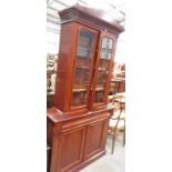 19TH CENTURY MAHOGANY BOOKCASE WITH 2 GLAZED DOORS OVER DRAWER AND 2 PANEL DOORS ON PLINTH BASE