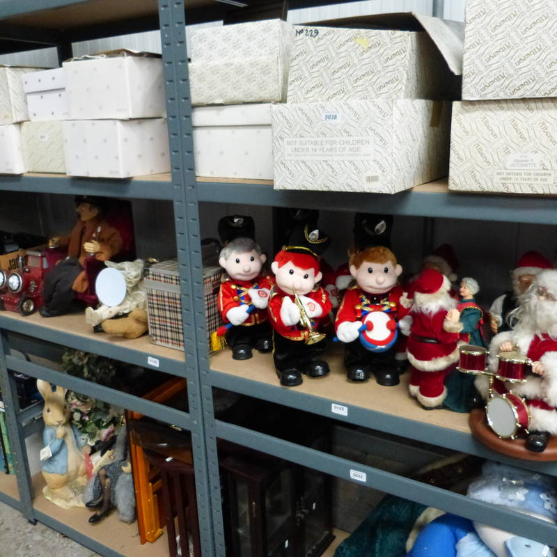 ASSORTED MUSICAL BAND MEMBER SOFT TOYS MUSICAL SANTAS, MODEL TRACTOR AND TRAILER, OVER THREE SHELVES