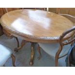 LATE 19TH CENTURY INLAID WALNUT OVAL BREAKFAST TABLE WITH CARVED SPREADING SUPPORTS