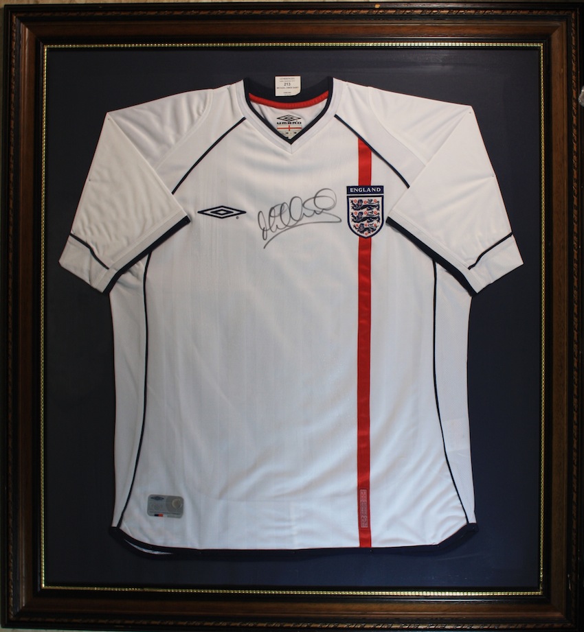 Michael Owen Signed England Shirt. An official 2001 England shirt signed in black pen by Michael