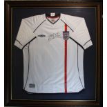 Michael Owen Signed England Shirt. An official 2001 England shirt signed in black pen by Michael