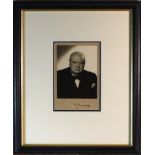 Winston Churchill Signed Photograph. A Black and white 5x4” photograph signed in blue ink by Winston