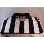 Alan Shearer Signed Newcastle Shirt. A Newcastle United No.9 shirt signed on the front in black