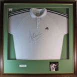 Tim Henman Signed Shirt. A white Addidas Tennis shirt identical to the one worn by Henman. Signed In