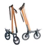 A Pair of Unusual Ritter Patent Roller Skates, each with two large spoked metal wheels, beech leg