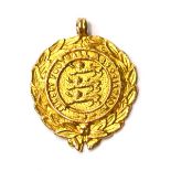 A 9ct Gold Jersey Football Association Medal, one side worked with three lions enclosed by a