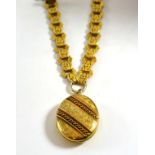 A Victorian silver gilt locket on necklace, the hinged locket with decorative front, attached to