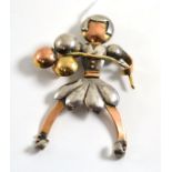 A tri-colour figural brooch, as a girl holding balloons, measures 4.6cm by 6.5cm