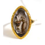 A mourning ring, of sepia painted ivory in a lozenge form, depicting a maiden at an urn below a