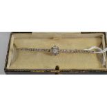 An early 20th century diamond bar brooch, a cluster of old cut diamonds to a tapered bar set with