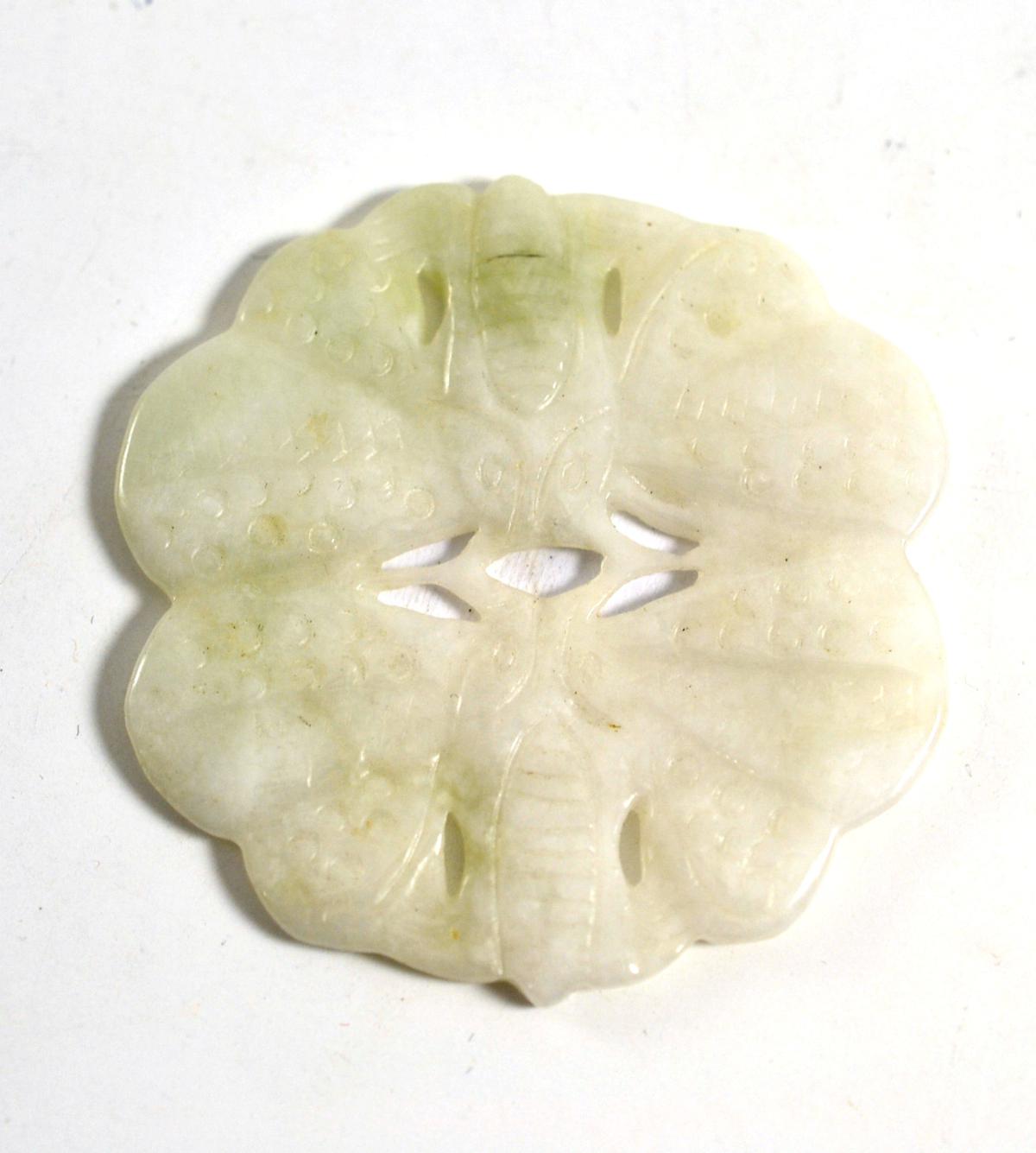 Carved jade pendant, 5cm diameter