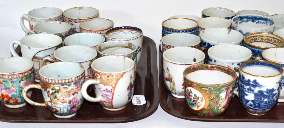 A collection of twenty eight 18th and 19th century Chinese export coffee cups (on two trays)