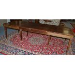 Mahogany and satinwood banded dining table on stop-fluted tapering legs