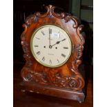 A mahogany striking table clock, circa 1830, applied scroll and floral decoration, 7-1/2-inch