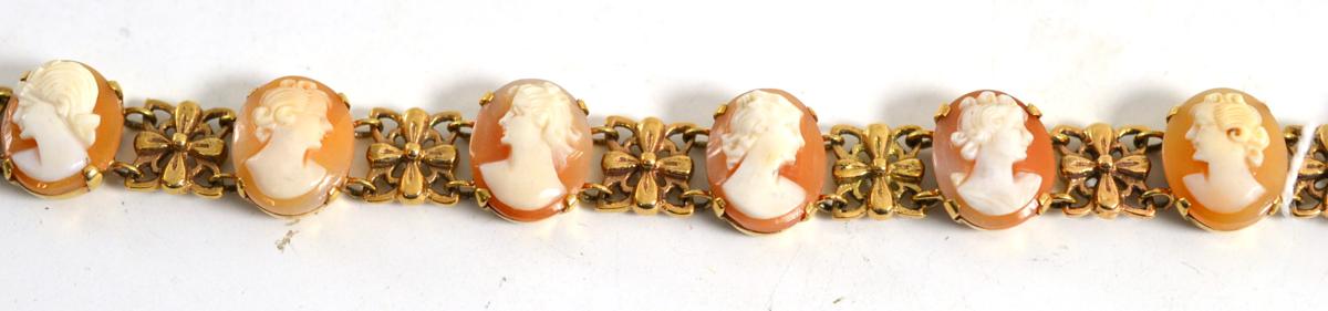 A cameo bracelet, the oval cameos alternate with floral links, length 19cm