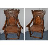 A pair of English joined oak armchairs, in 17th century style, the carved top rails above arched