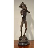 A bronzed figure of an elf, 63cm high