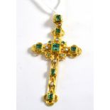 An emerald and pearl cross, of ornate form, inset with step cut emeralds and small pearls,