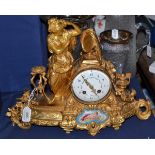 A gilt metal striking mantel clock, circa 1890, case depicting a classical figure in robes, floral