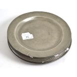Eleven pewter plates, 23cm diameter