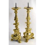 Pair of Italian brass candlesticks, 46cm high