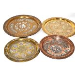 A signed Cairo ware copper and silver dish, 25cm in diameter, three  Cairo ware brass chargers 35cm,