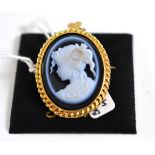 A 9ct gold cameo brooch/pendant, the onyx carved to depict a maiden with flowers in her hair,