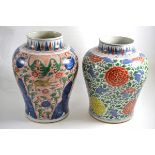 Two Wucai vases, 29cm and 20cm high (both restored)