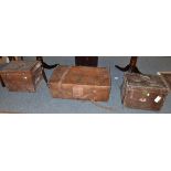 A leather suitcase with printed name 'W Marwood' and two picnic cases