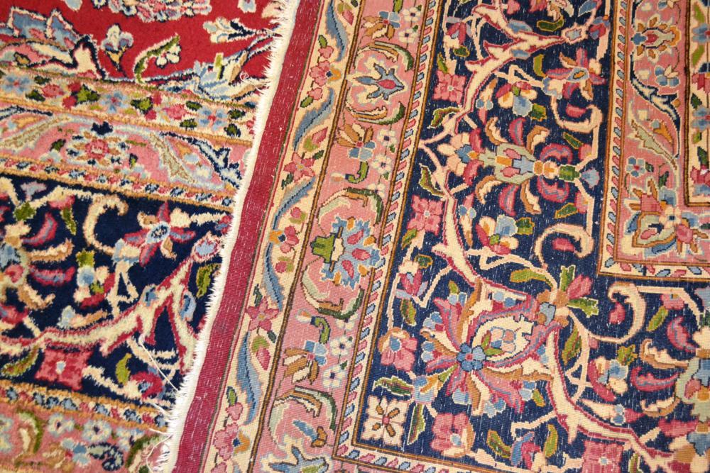 Kirman carpet, South East Persia, the raspberry field of scrolling vines around a floral medallion - Image 2 of 7
