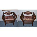 Pair of mahogany open armchairs with over-stuffed seats and scrolled arm support