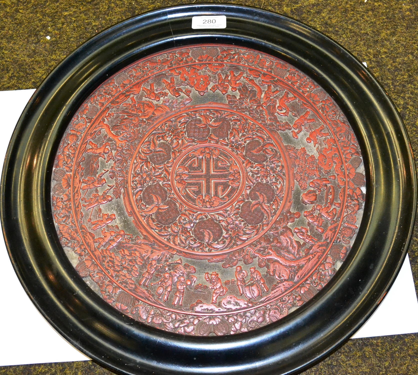 An 18th/19th century Chinese cinnabar lacquer circular panel (a.f.), 31cm diameter (excluding frame) - Image 2 of 5