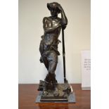 Bronze figure of a farm worker standing with a sickle, stamped Eugene Marioton with foundry mark,