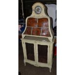 An unusual Italian green painted chest clock with circular brass dial and five drawers below, raised