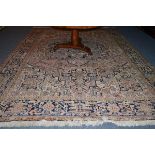 Heriz carpet, Persian Azerbaijan, the faded rose pink field with indigo medallions framed by