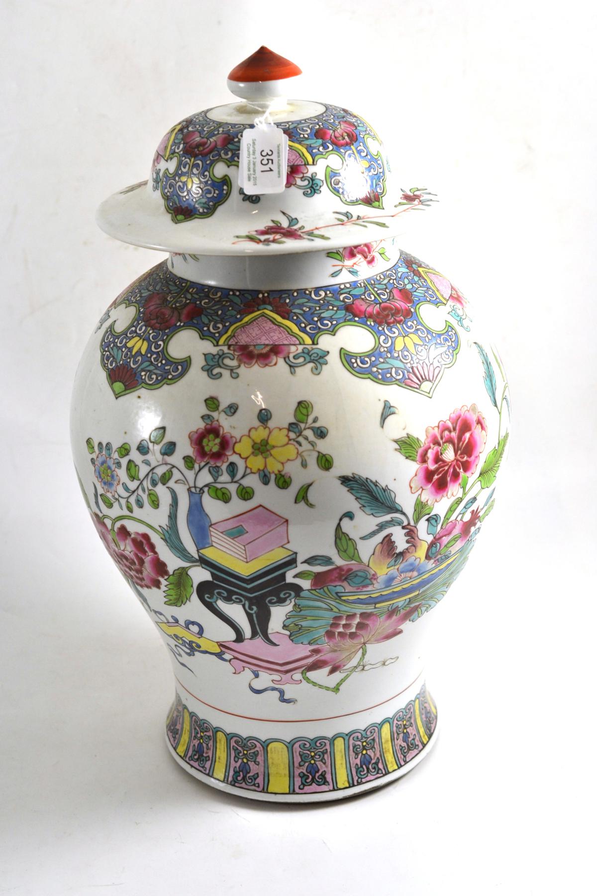 A large Chinese famille rose porcelain baluster vase and cover painted with precious objects and