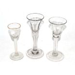 Two 18th century wine glasses with plain stems and an opaque twist glass (3)