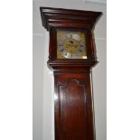 An oak eight day longcase clock, caddied pediment, double D-ended moulded trunk door, glazed