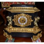 An ormolu and black slate striking mantel clock, circa 1880, winged cherubs and ormolu scroll