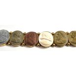 A lava bracelet, seven panels each depicting assorted portraits, length 16.5cm,   NB one panel out