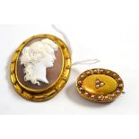 A cameo brooch, depicting a Bacchante, in a yellow rubbed over setting within a rope twist decorated
